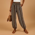Hoge taille damesbroek met boho uitstraling en losvallende pasvorm, ideaal voor casual en chique zomerse outfits.