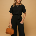 Women’s elegant jumpsuit with tailored fit and flowing sleeves, available in black, beige, and green. Perfect for galas, weddings, and evening occasions.