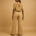 Women’s elegant jumpsuit with tailored fit and flowing sleeves, available in black, beige, and green. Perfect for galas, weddings, and evening occasions.