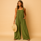 Women’s summer jumpsuit with high waist, wide legs, and button details. Lightweight and breathable design, perfect for casual or evening looks.